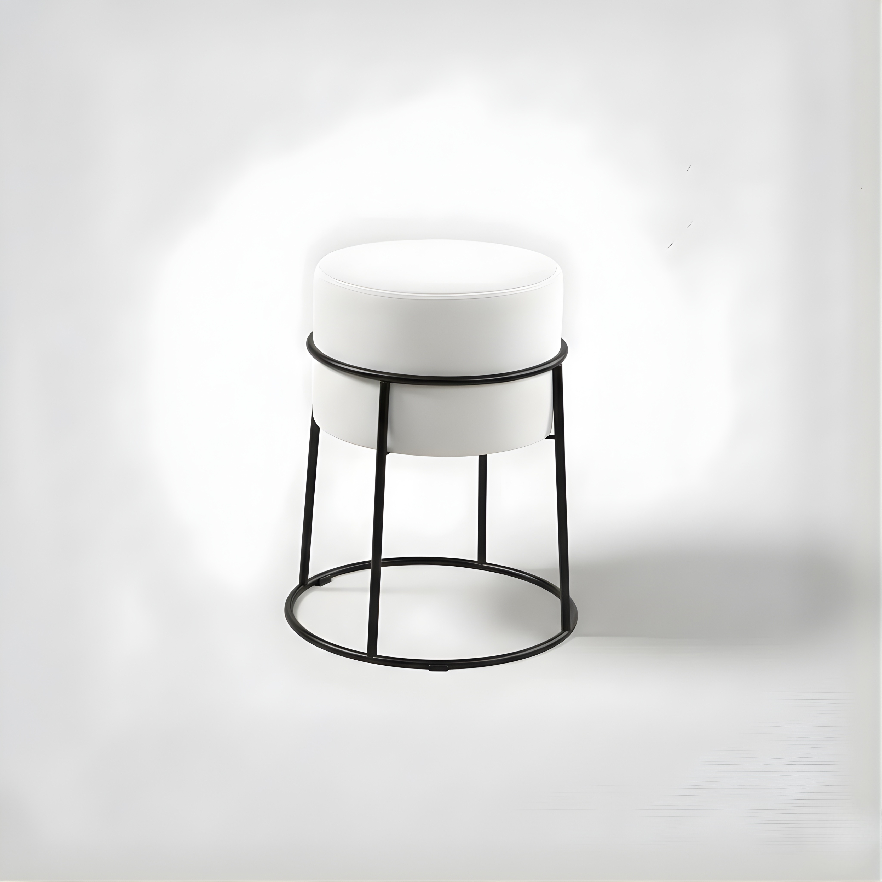 Stylish round ottoman with golden legs, portable comfort stool.