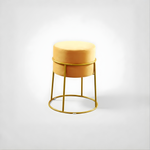 Stylish round ottoman with golden legs, portable comfort stool.