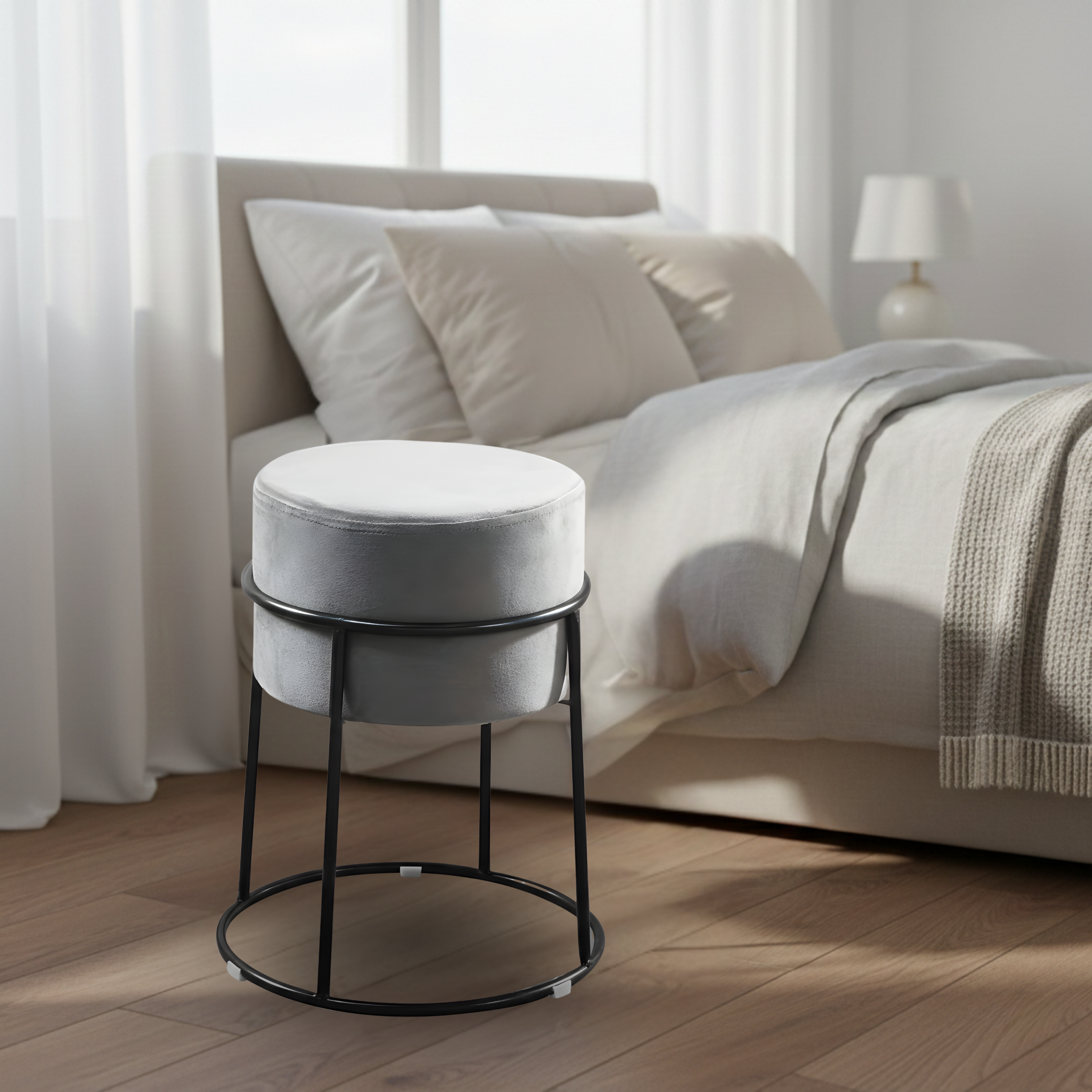 Stylish round ottoman with golden legs, portable comfort stool.