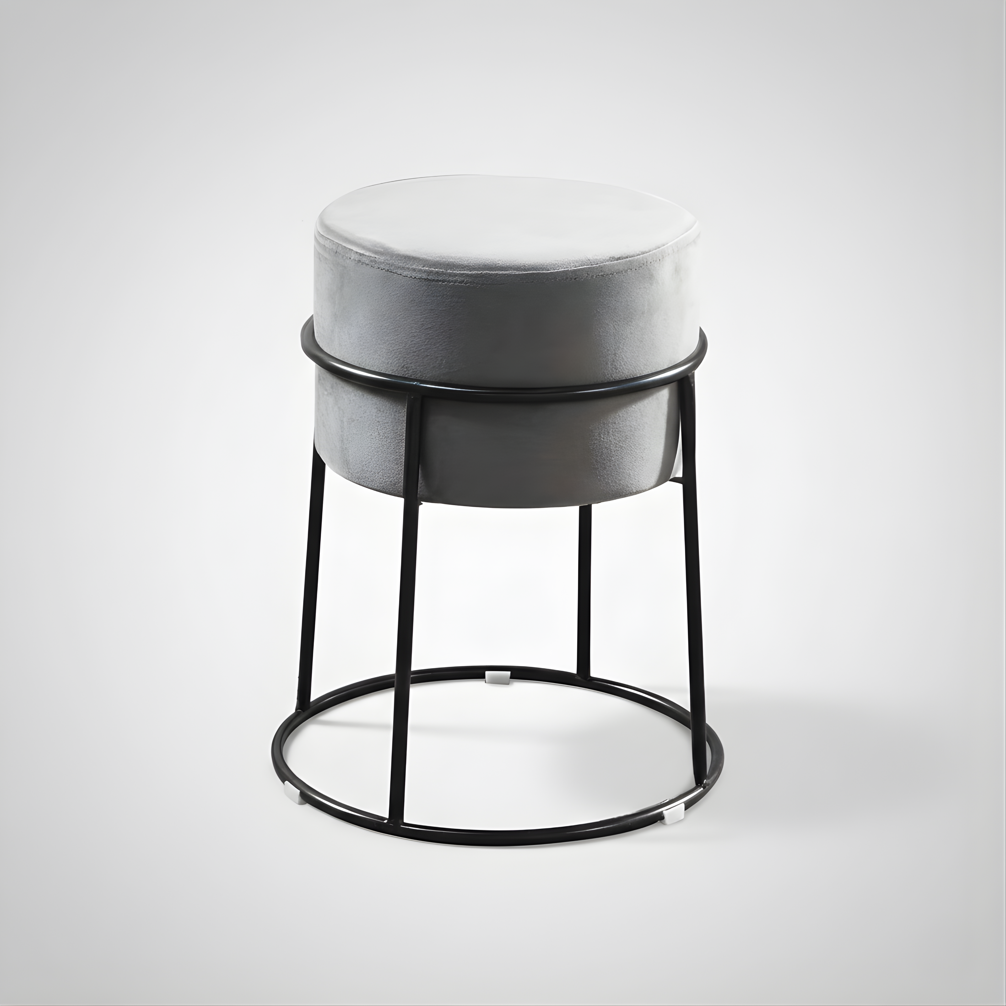 Stylish round ottoman with golden legs, portable comfort stool.